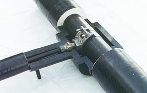 Pre-insulated saddle and corporation stop kit on a 25 mm (1 in) HDPE pre-insulated service.